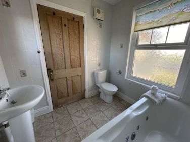 Bathroom on first floor with jacuzzi bath