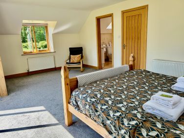 Very spacious bedrooms, this photo shows the doorway to upstairs bathroom,