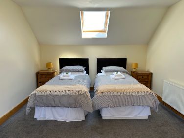 Twin divan beds in the second upstairs bedroom