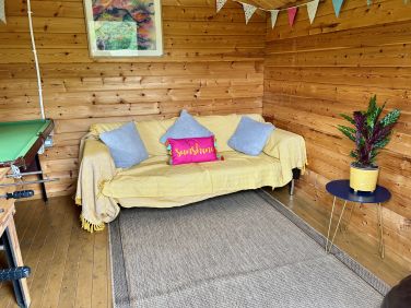 The garden cabin has a sofa so it can be a peaceful place to escape to