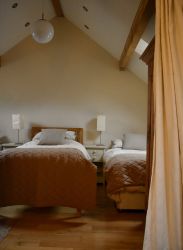 Hayloft Family room with three single beds.