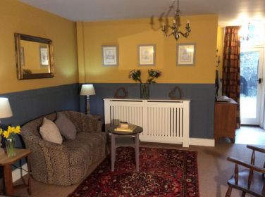 Enjoy An Early Morning Coffee in the Comfy Bedroom Seating Area