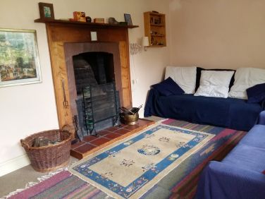 Sitting room again with original fire.
