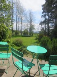 Patio looking out to large garden Upper Finlarig Cottage.