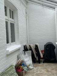 Plenty of storage and garden chairs and cushions.