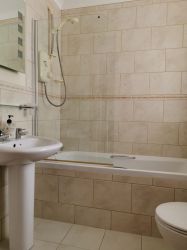 Downstairs Bathroom with power shower over bath