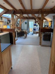 Looking down the length of the cottage from bedroom door