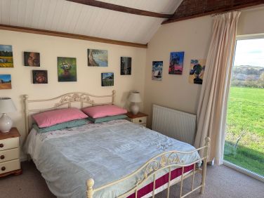 King size bed with views over the fields
