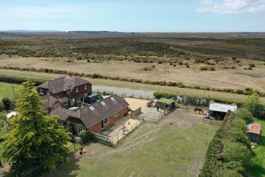 /Aerial view Bartley Barn across the forest, Isle of Wight in distance