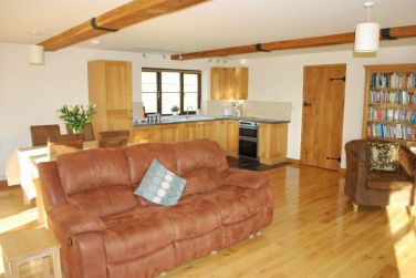 Looking across the lounge to the kitchen