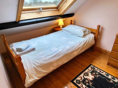 Upstairs twin bedroom with Velux window