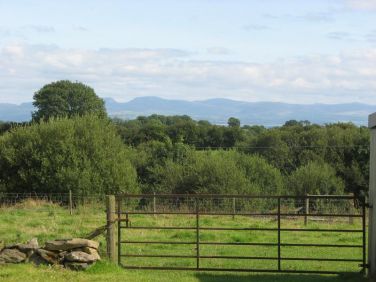 View from gate towards lake and distant mountains