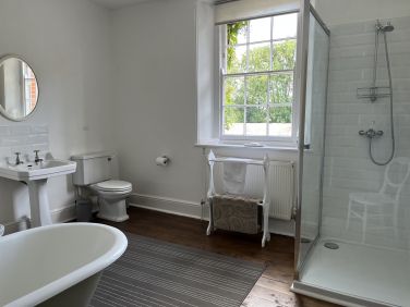 Family bathroom with roll top bath and shower