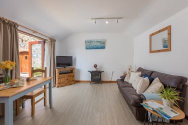 TV with DVD player and electric stove for cosy nights in.