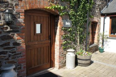 Front door leads to enclosed courtyard