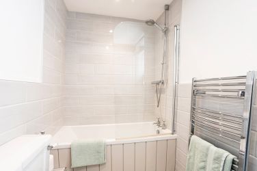 Bath with shower over