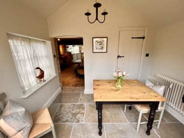Sun room where you can enjoy breakfast overlooking the garden