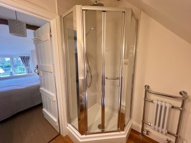 Ensuite with Pentaganol shower cubicle with overhead fixed drencher and additional handset