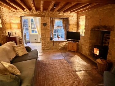 Snuggle up in front of the flickering flames of the log burner - a magical atmosphere