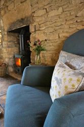 Relax in front of the flickering flames of the log burner
