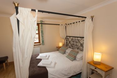 Master bedroom with four poster bed