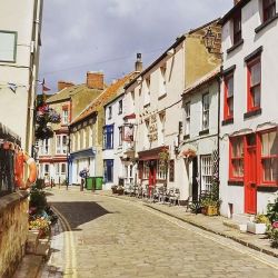 Staithes' cobbled streets and winding alleyways in front of the Royal George pub