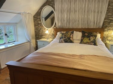 Comfortable king size oak bed with quality bedlinens