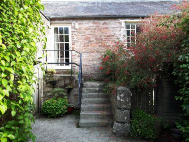 Steps leading to Spry's entrance door