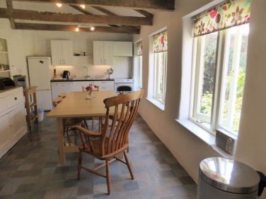 The kitchen overlooking the walled garden, the Coach House