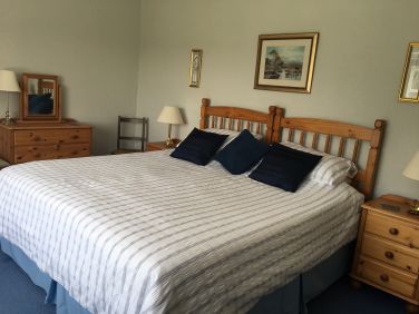 Main room with super king size zip&rsquo;n&rsquo;link bed. (fitted with quilted mattress protector)