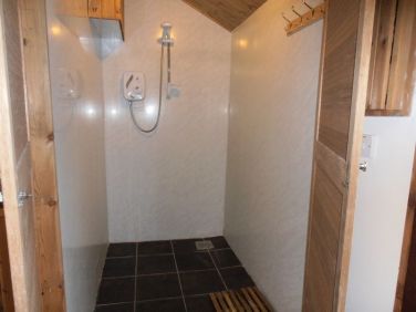 The large games room shower is ideally situated next to the hot tub.