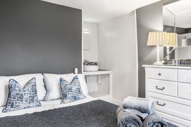 Master bedroom with double bed and sink