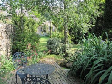 Decking by pond at far end of garden