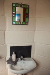 Separate toilet and basin off kitchen