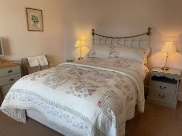 Ground floor double bedroom with view of the garden