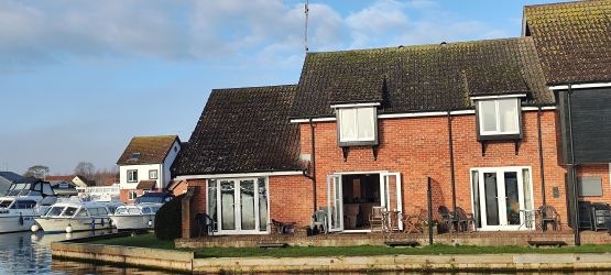 Bure Cottage with French doors open