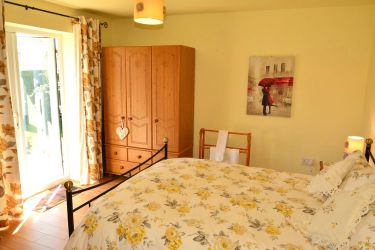 French doors leading into the garden from the bedroom