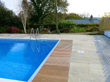 Pool with the house beyond