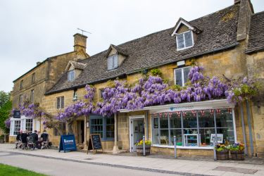 Broadway High Street with the seasonal Wisteria