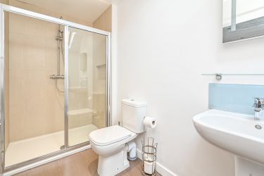 Large power shower, light and airy ensuite to bedroom 6.