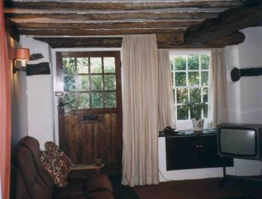 Beamed sitting room with TV