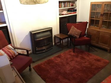 Living flame gas fire, fine oak glasses cabinet, comfy seating