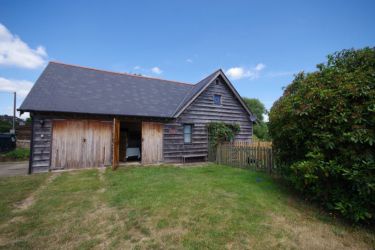 Garage to the barn which is great for bike storage
