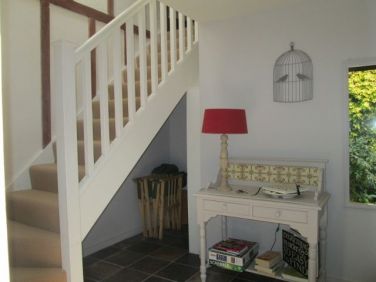 Stairs take you up to the spacious first floor apartment