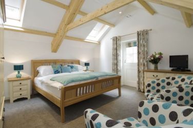 Chairs for relaxing in the bedroom as well as TV