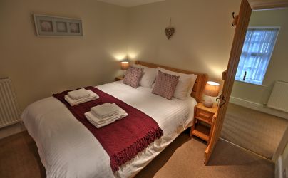 Bedroom 1 - Kingsize bed and lovely views from the window seat