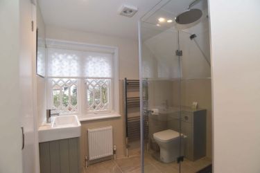 Stylish modern shower room with drencher shower