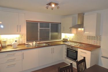 Stylish, well-equipped kitchen and dining area.