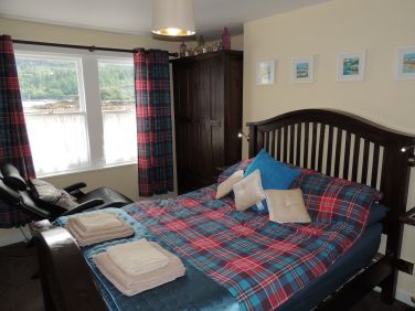 The downstairs bedroom has an electric massage chair to relax on.