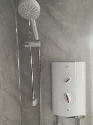 Powerful electric shower in large walk in shower cubicle